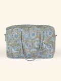 Quilted duffle bag for men and women in the Blue Sea of Flowers print by Khasto: a product of craftsmanship and sustainability. A small travel bag for every day use.