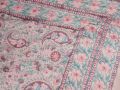  A quilt with a timeless design handprinted in the Pink Paisley print. The quilt blanket can be used on top of a duvet or on a summer sheet for extra warmth.