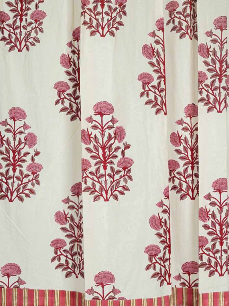 Floral curtains by Khasto a product of craftsmanship and sustainability. The red curtain is hand block printed.