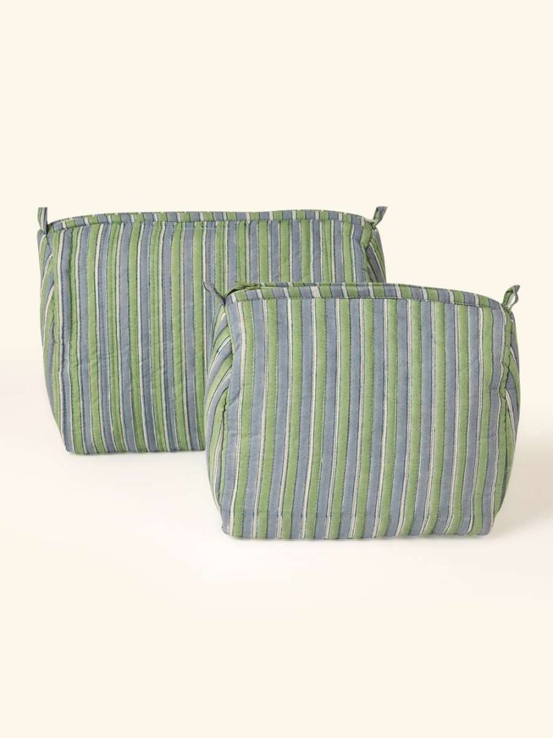 Portable toilet bags by Khasto a product of craftsmanship and sustainability. The portable toilet bags are hand block printed and quilted Various designs for womens and mens toiletry.