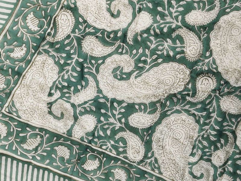 A quilt with a timeless design handprinted in the Green Paisley print. The quilt blanket can be used on top of a duvet or on a summer sheet for extra warmth.