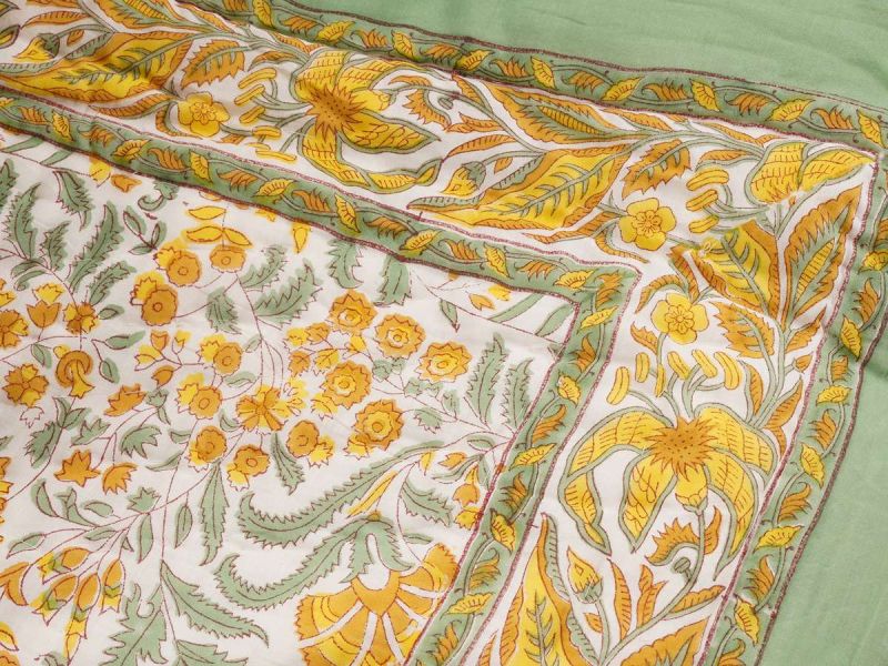  A quilt with a timeless design handprinted in the Jardin du Soleil print. The quilt blanket can be used on top of a duvet or on a summer sheet for extra warmth.