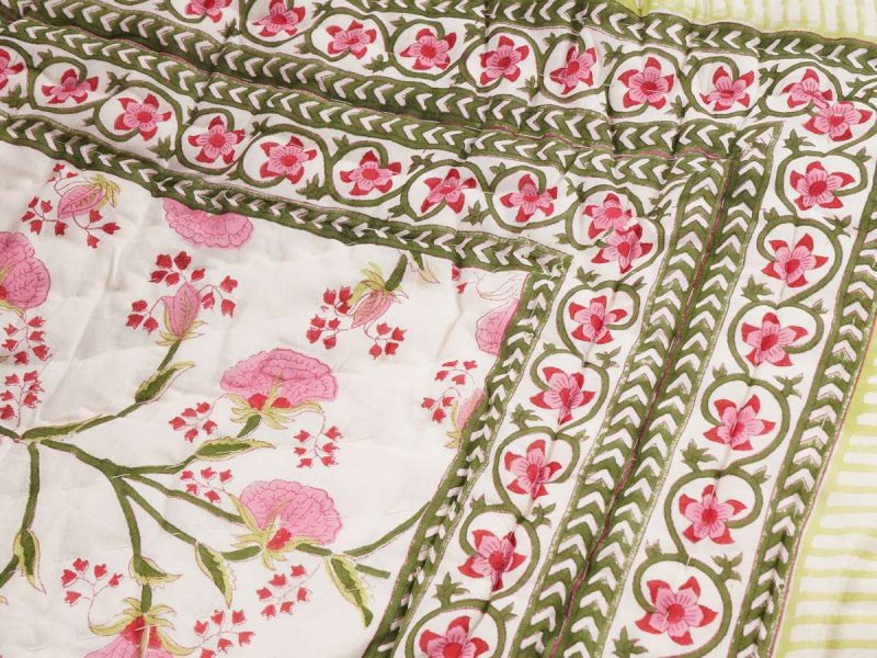  A quilt with a timeless design handprinted in the Pink Lily print. The quilt blanket can be used on top of a duvet or on a summer sheet for extra warmth.