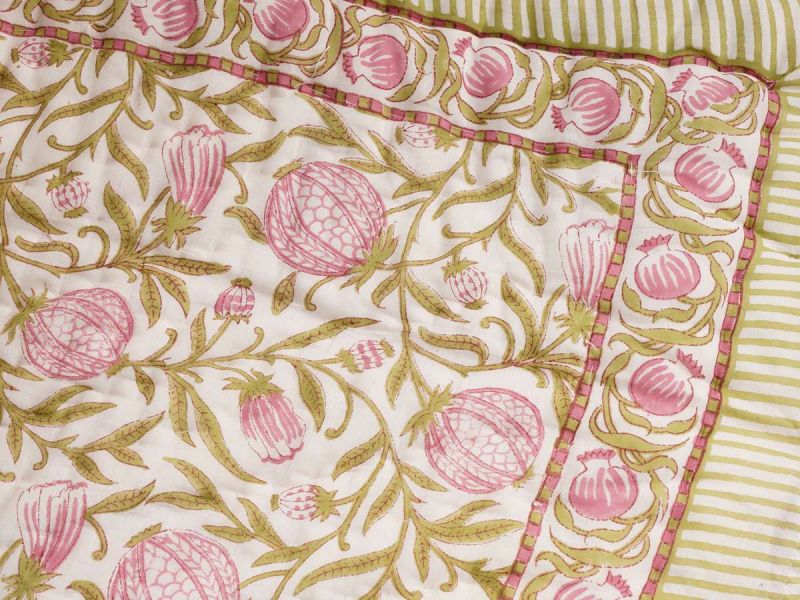  A quilt with a timeless design handprinted in the Pomegranate print. The quilt blanket can be used on top of a duvet or on a summer sheet for extra warmth.
